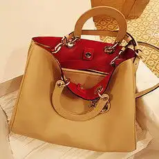 伊米妮2012新款牛皮复古欧美风铆钉包手提斜挎包女包包u2071701
